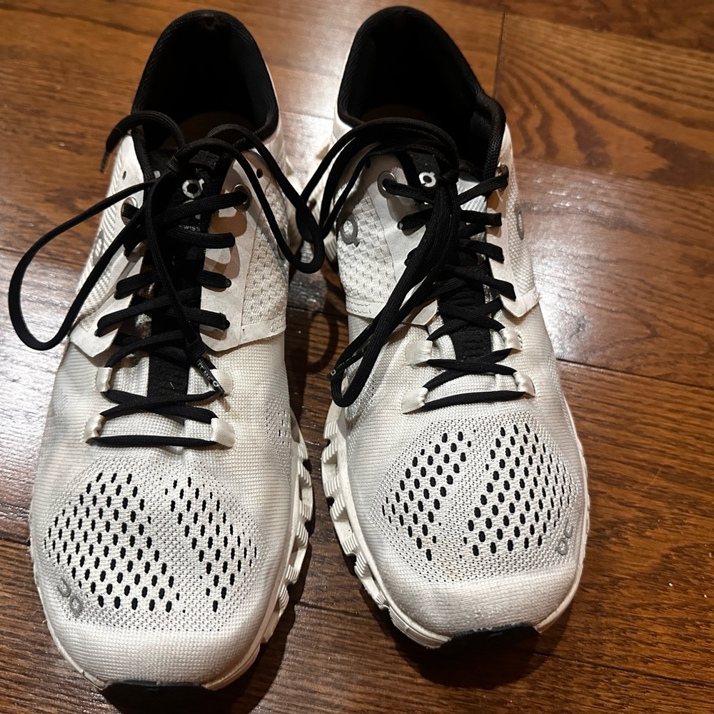 On Running White and Black Athletic Shoes